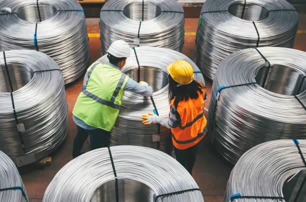 istock Young industry employees checking production line in wire warehouse 1271680289