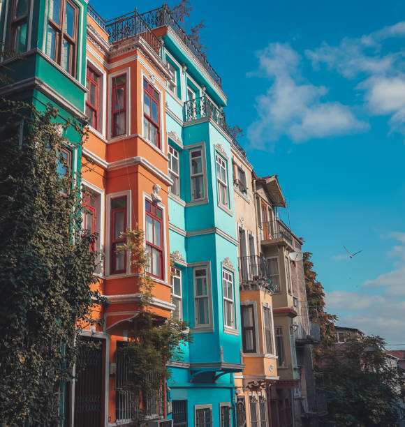 Colorful Houses in Istanbul, people walks in street which has Old Houses in Balat, Istanbul.