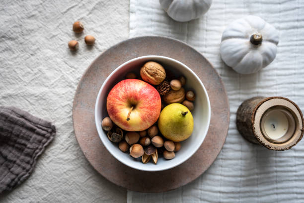 Fruit, linen tablecloth, top view, healthy food, walnut, candle, desaturated, dinnerware, festive