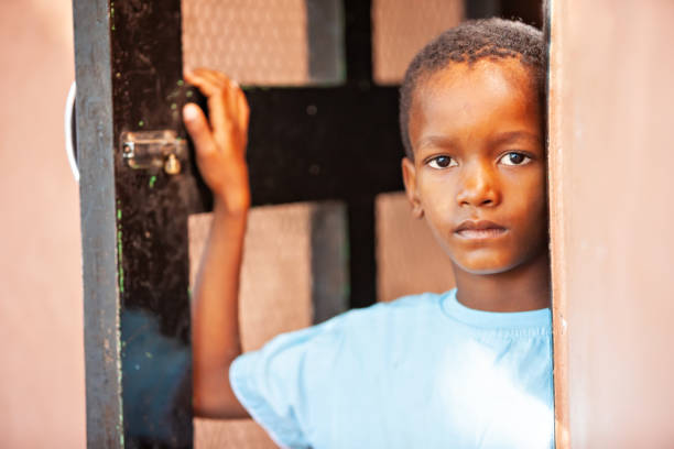 Studio portrait young black boy, tween, looking to camera