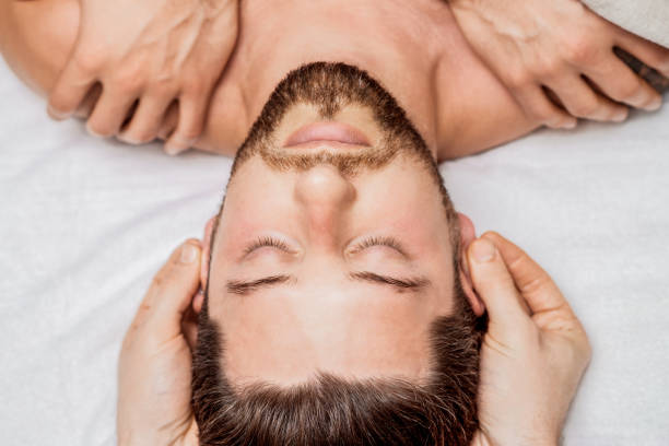 istock Young man receiving head massage. 1271681644