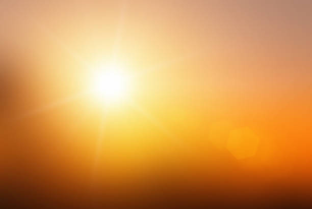 istock Natural background blurring warm colors and bright sun light. Bokeh or Christmas background Green Energy at sky sunny color orange light patterns plain abstract flare evening clouds blur. 1271681656