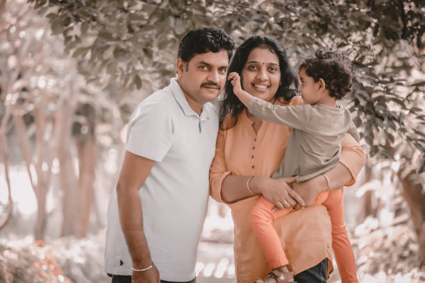 istock Family has fun playing in the park 1271683177