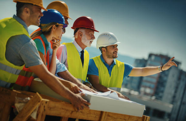 istock Group of contractors supervising building process 1271683209
