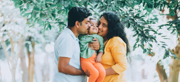 istock Family has fun playing in the park 1271687898