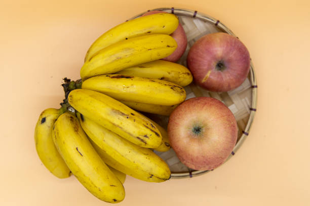 istock Banana and Apple in basket 1271688788