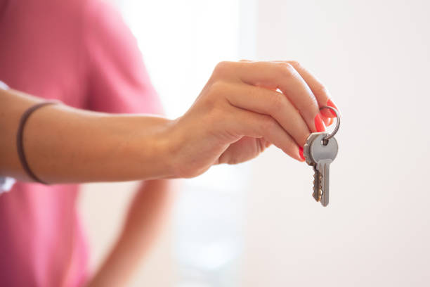 istock Woman giving key 1271689068