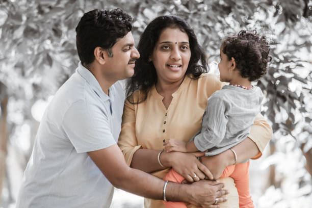 istock Family has fun playing in the park 1271689187