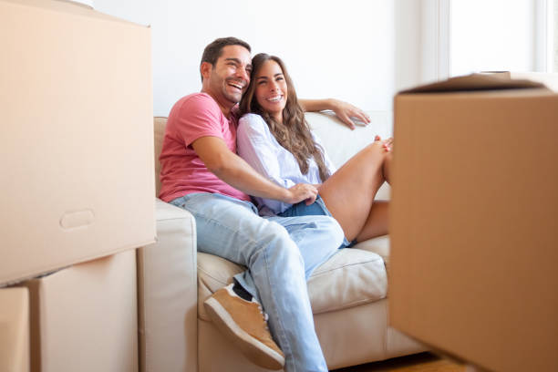 istock Joyful Latin couple enjoying new home 1271689896