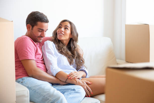 istock Happy relaxed young couple enjoying new home 1271690908