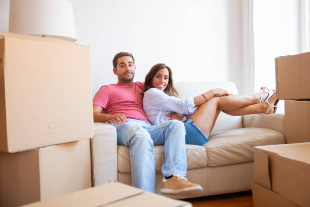 istock Happy Latin young couple sitting on couch 1271693279