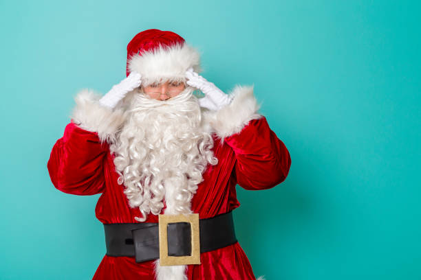 istock Santa Claus having a headache 1271694709