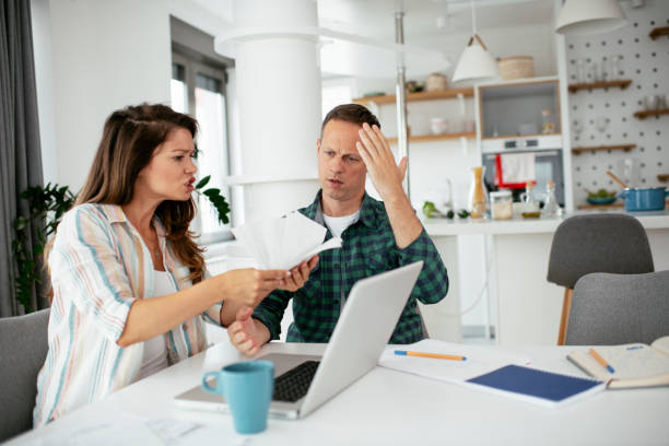 istock Husband and wife preparing bills to pay 1271695815