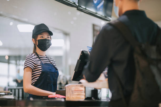 istock asian chinese cafe cashier servicing and packing for her customer 1271696085