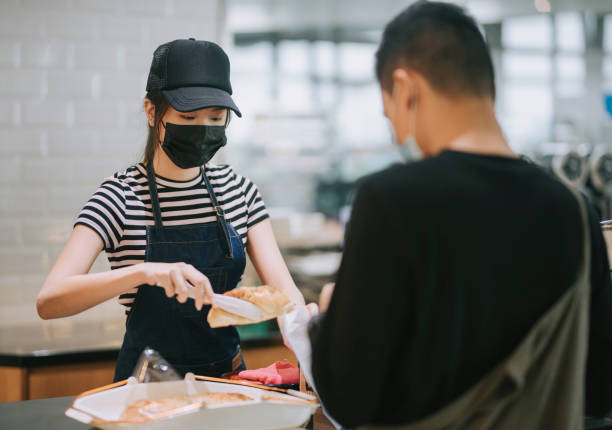 istock asian chinese cafe cashier servicing and packing for her customer 1271696092