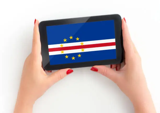 Republic of Cabo Verde flag on tablet in female hands Flag from https://www.countryflags.com/en/ free for commercial use see release