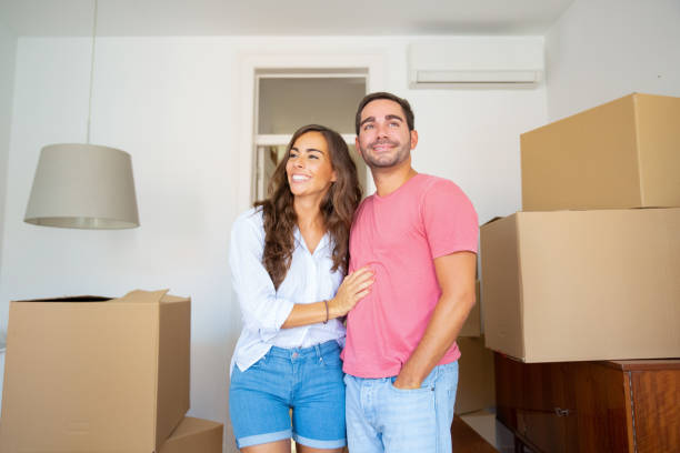istock Cheerful couple looking over their new apartment 1271698772