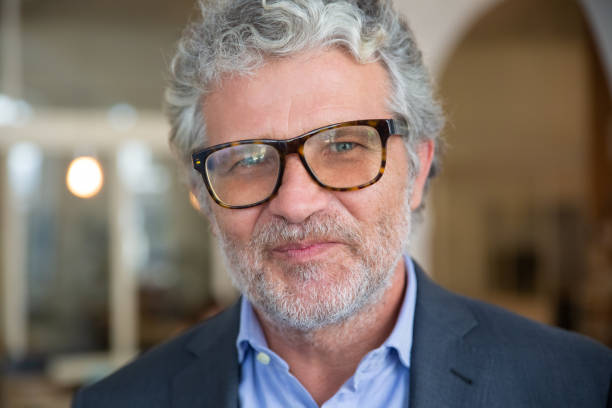 istock Happy friendly mature business man 1271698833