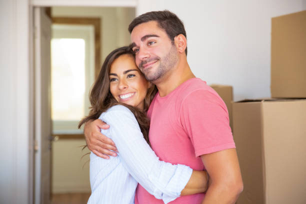 istock Joyful couple moving into new house 1271698923