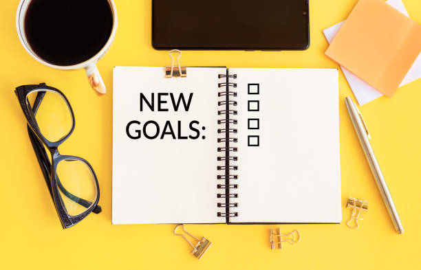 istock NEW GOALS, plan, action text on notepad with office accessories. Business motivation,inspiration concepts 1271699272