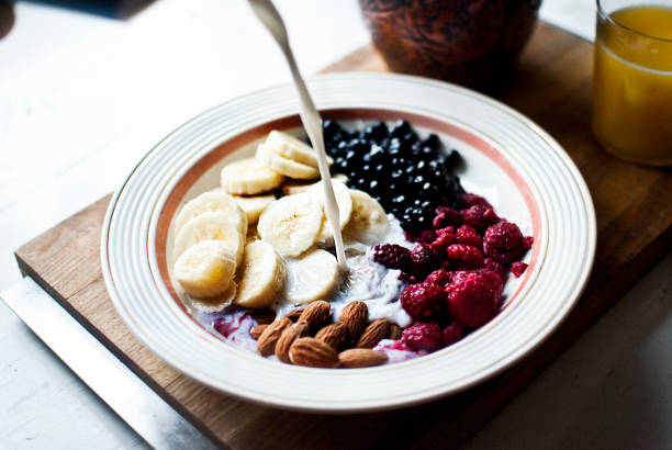 Berries, fruit and almonds with milk