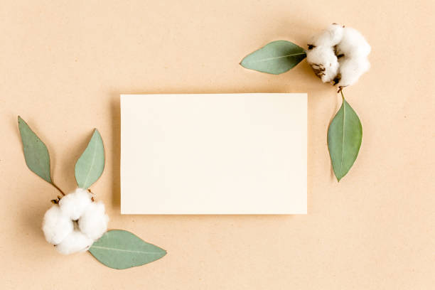 istock Mockup invitation, blank greeting card and green leaves eucalyptus. Flat lay, top view 1271700870