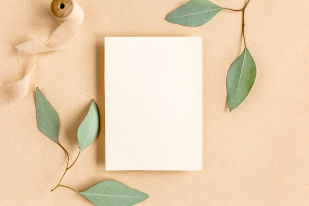 istock Mockup invitation, blank greeting card and green leaves eucalyptus. Flat lay, top view 1271701171
