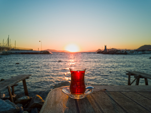 Glass of Turkish Tea on the Table. Sunset Background
