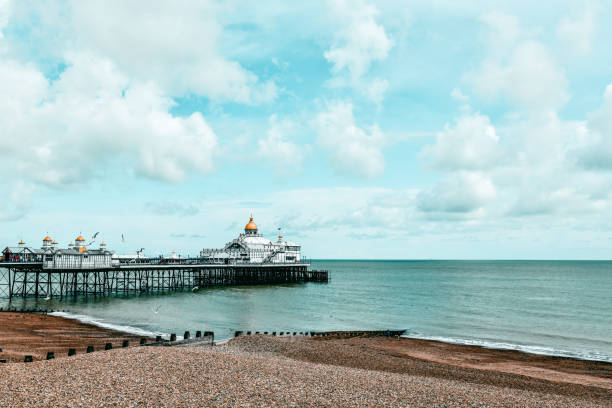 istock Large Pier House Seen From Eastbourne Beach, UK 1271702599