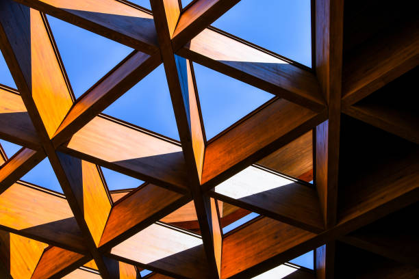 Roofing Construction. Wooden Roof Frame House Construction. Abstract Structure background. Wood texture pattern.