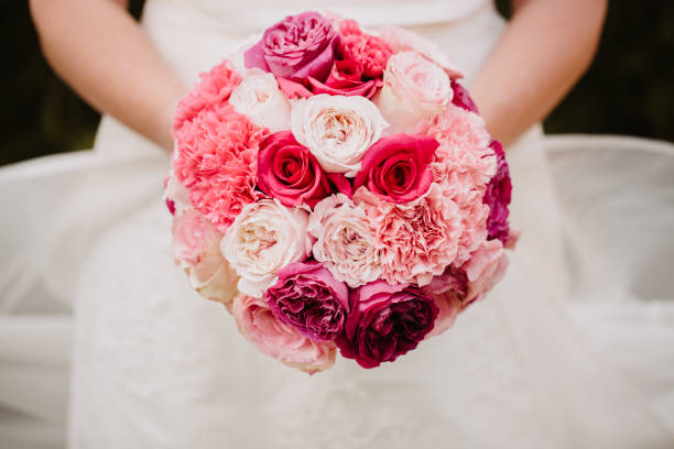 Pink wedding bouquet with roses and carnations