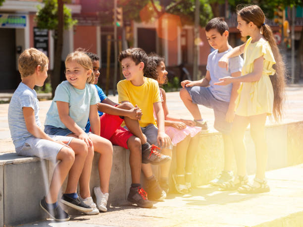 istock Group children are talking about play on walk in the park 1271707273