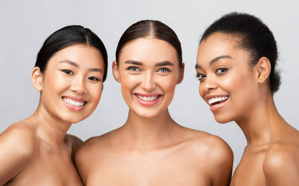 istock Three Diverse Models Girls Smiling Posing Shirtless On Gray Background 1271707696