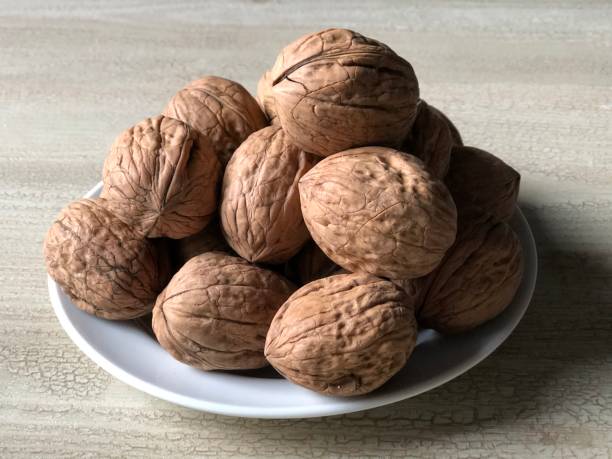 istock Close-up image of ripe walnuts in various compositions 1271708908
