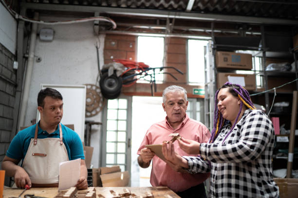 istock Coworkers checking some toys in a factory and using digital tablet 1271709041