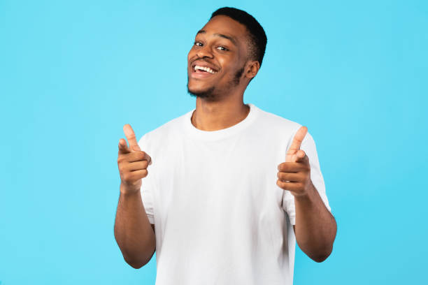istock Cheerful Black Man Pointing Fingers At Camera On Blue Background 1271710236