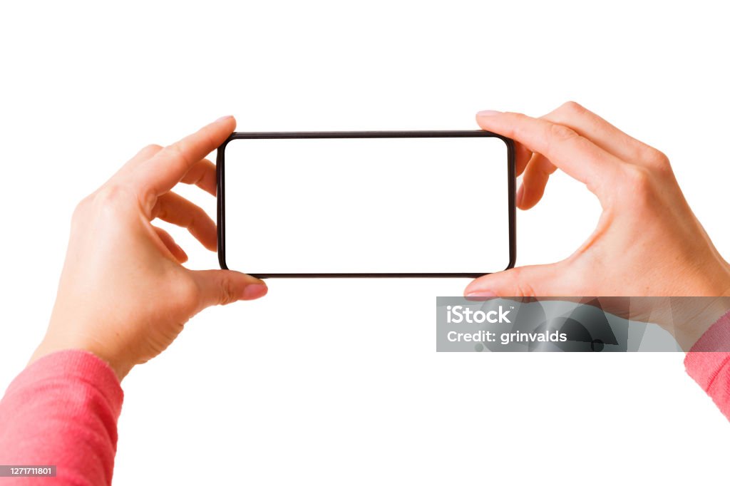 Person holding in hands smartphone with blank screen and taking picture or recording video Person holding in hands smartphone with blank screen and taking picture or recording video, photo isolated on white background Home Video Camera Stock Photo