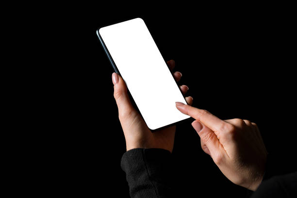 istock Person holding in hands and using mobile phone with empty white screen 1271711821