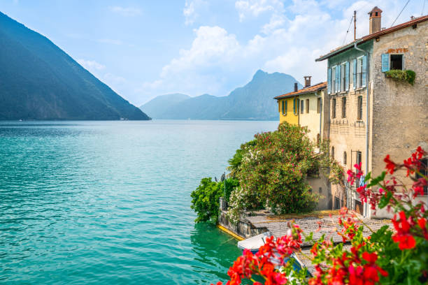 colorful houses and flowers of gandria village and scenic view of lake lugano on summer day in ticino switzerland - switzerland ticino canton lake lugano imagens e fotografias de stock