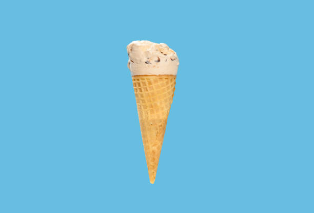 istock milk tea flavor ice cream cone with some bites on a blue background horizontal composition 1271714330