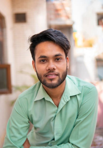 istock Indian young man in formal shirt looking at camera with smile. 1271714951