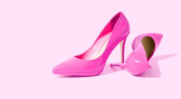 Woman Shoes Banner. High heels closeup. Top view. Women fashion. Ladies accessories. Girly casual formal shoe isolated. pink background. Footwear on floor. Copy space, mockup. flat lay Selective focus