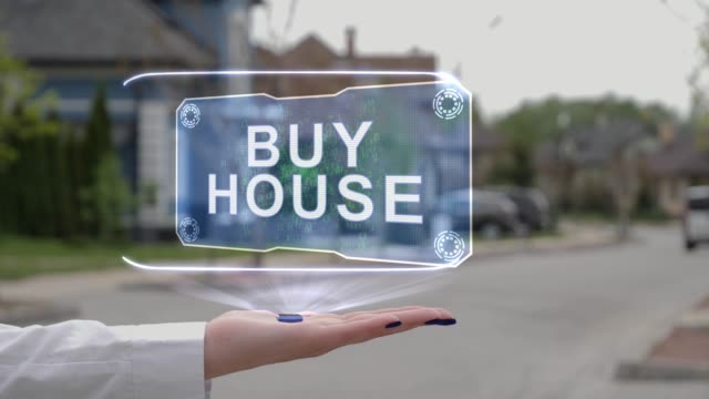 Female hand showing hologram Buy house
