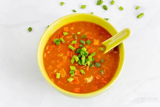 Vegan Vegetable Soup in a Bowl with Spoons Close-Up Photo
