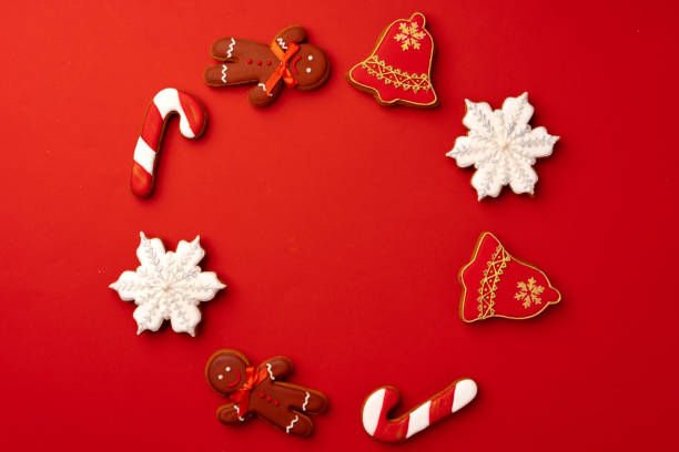 istock Christmas gingerbread cookies on red background top view 1271717971