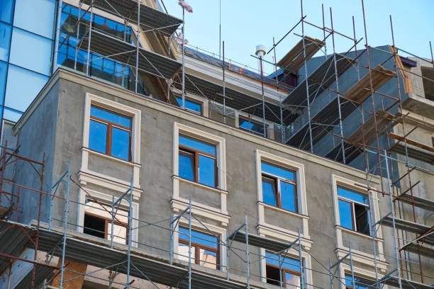 istock scaffolding and new building as background 1271719209