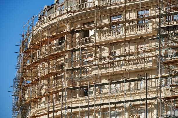 istock scaffolding and new building as background 1271719259