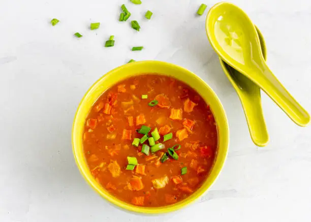 Healthy Vegan Vegetarian Soup in a Bowl with Spoon Directly Above Horizontal Photo