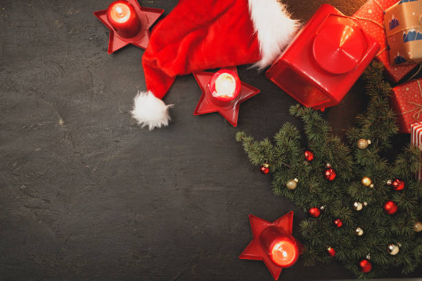 istock Festive Christmas composition with gift boxes, fir tree branches and decorations 1271721278