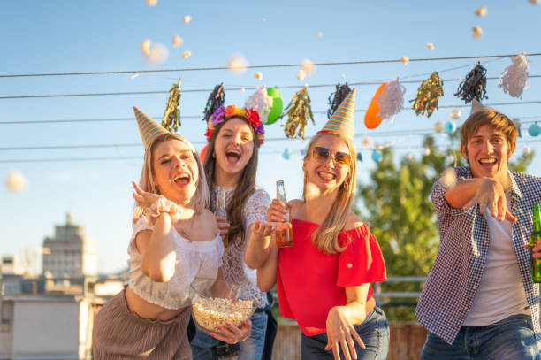istock Group of young people having party on a rooftop 1271723721